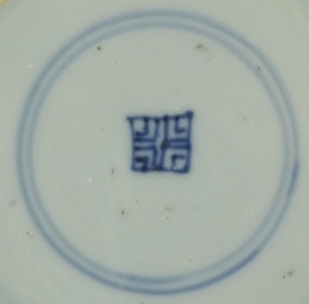 2010291 Shop mark in a double circle, underglaze blue.